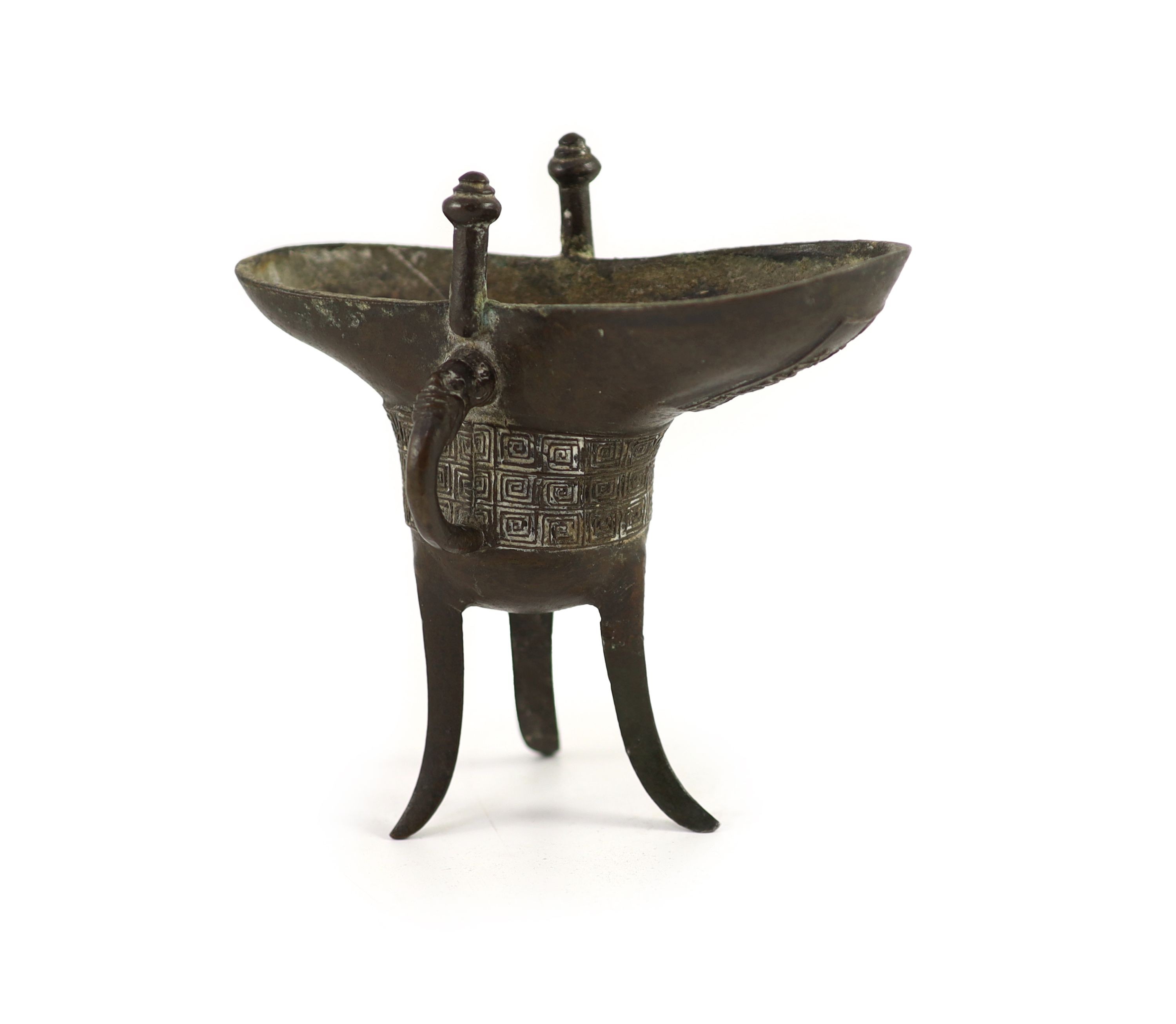 A Chinese archaistic bronze ritual tripod wine vessel, jue, Qianlong cyclical date mark and period, 16 cm high